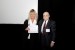 Dr. Nagib Callaos, General Chair, giving Prof. Suzanne Lunsford the best paper award certificate of the session "ICT Applications in Education (IMCIC / ICETI) ." The title of the awarded paper is "Science and Math Lesson Plans to Meet the Ohio Revised Science Standards and the Next Generation of Standards for Today; Technology (Excel)."